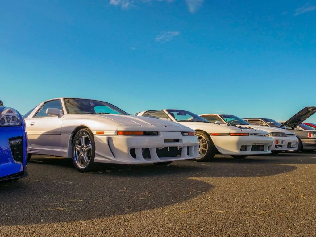 JDM cars lined up during a car meet in Japan