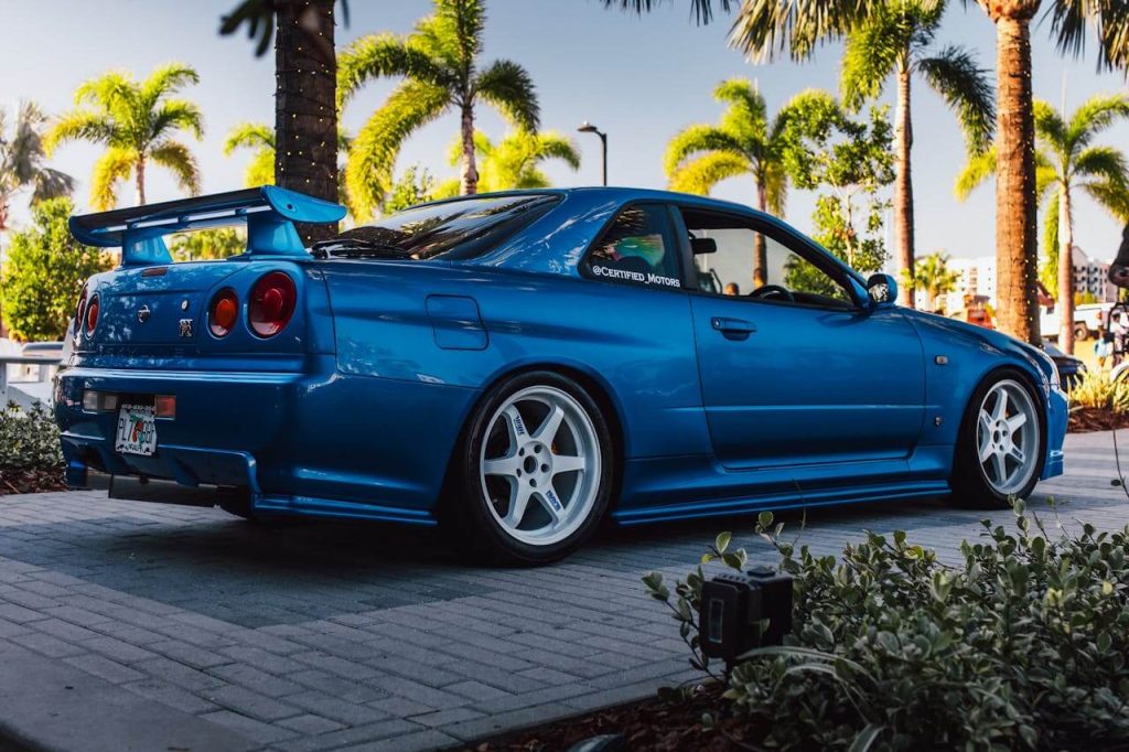 Blue Nissan Skyline GT-R R34, a JDM legend often seen at Daikoku PA